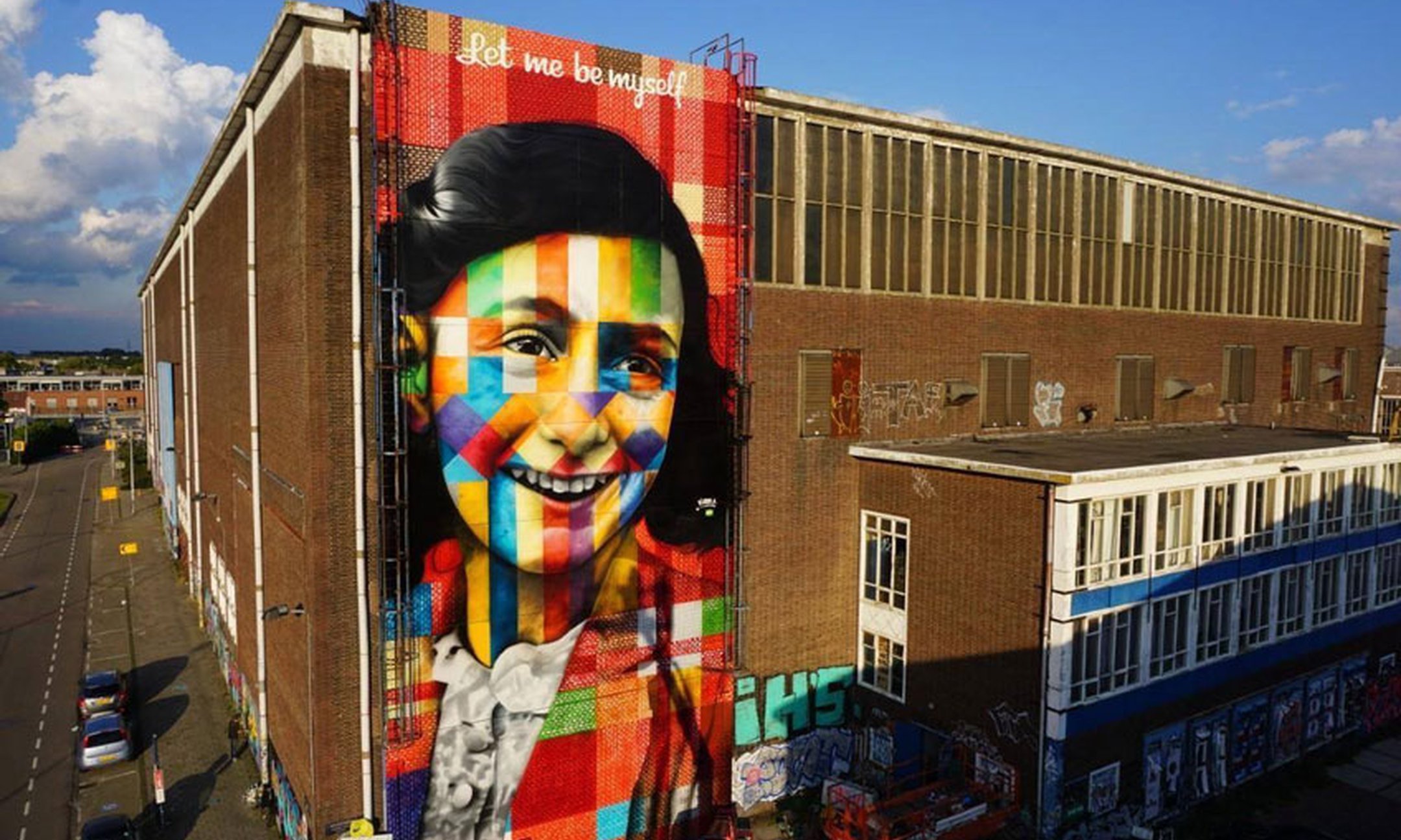 Brazilian artist Eduardo Kobra made a gigantic graffiti portrait of Anne Frank at the NSDM shipyard in Amsterdam.