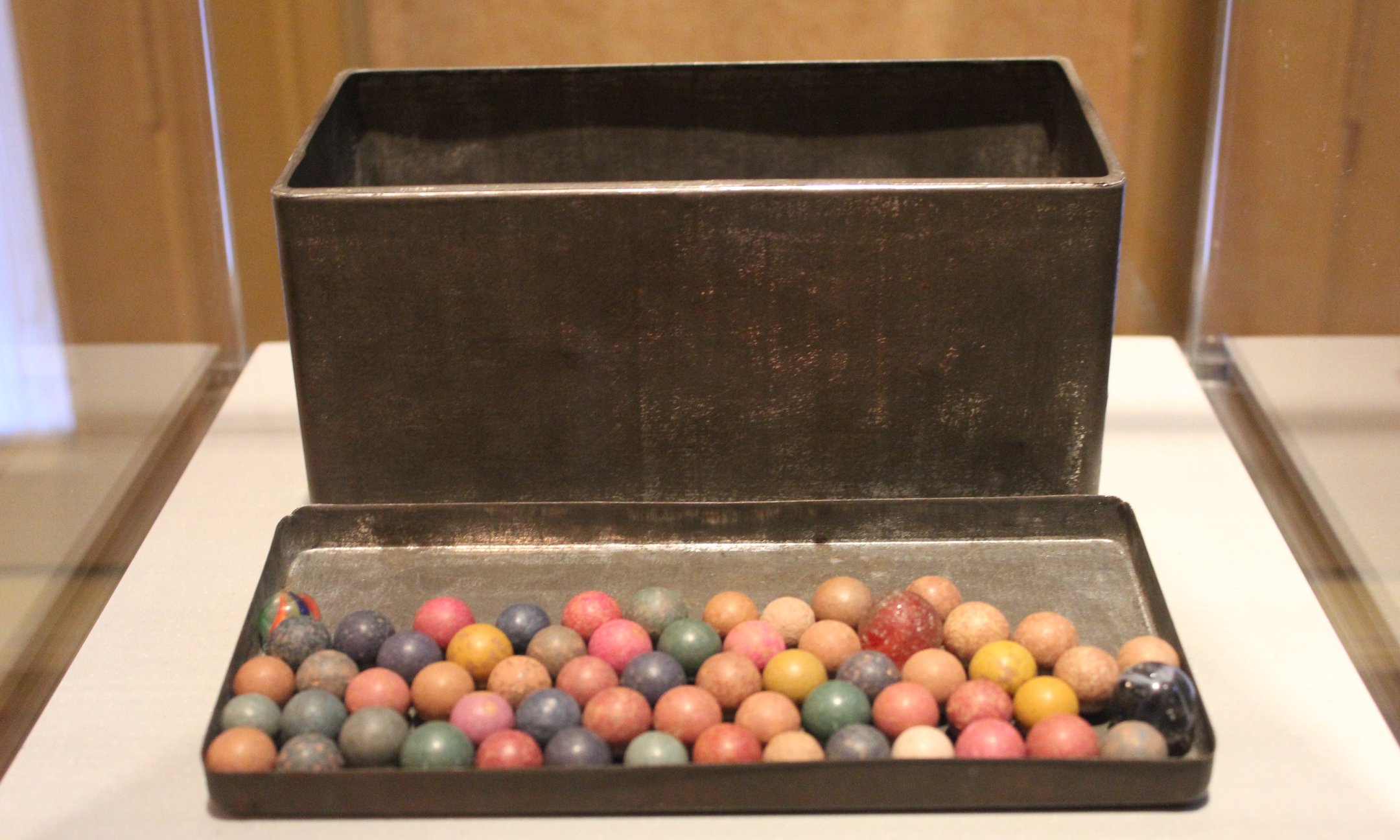Metal tin with marbles