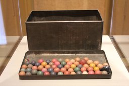 Anne’s metal tin with marbles