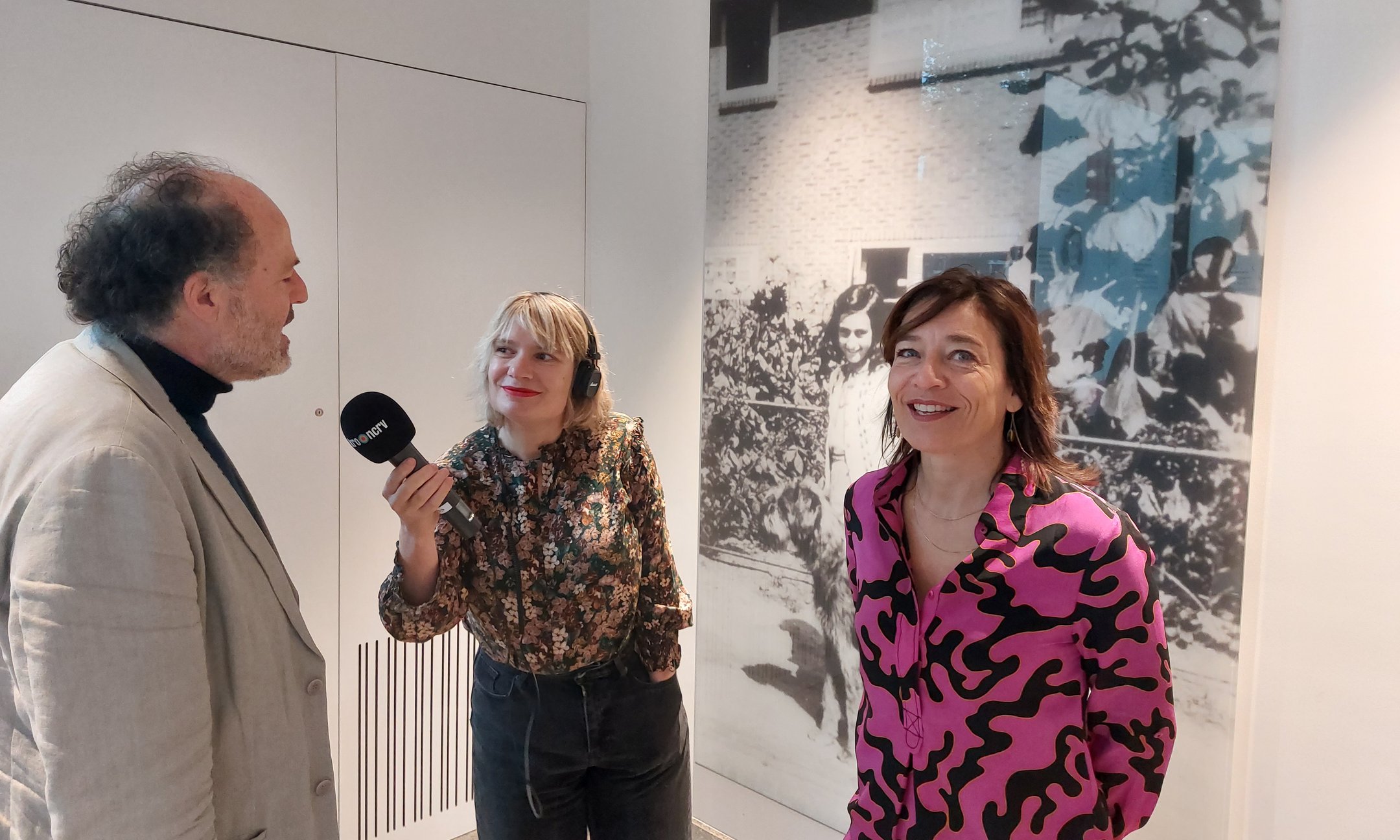 Anne van der Veen reporter from NPO radio 1 talking to Ronald Leopold, executive director Anne Frank House, and right Cathelijne Broers, director Prins Bernhard Cultuur Fonds, during the announcement on the radio programme 'Spraakmakers'