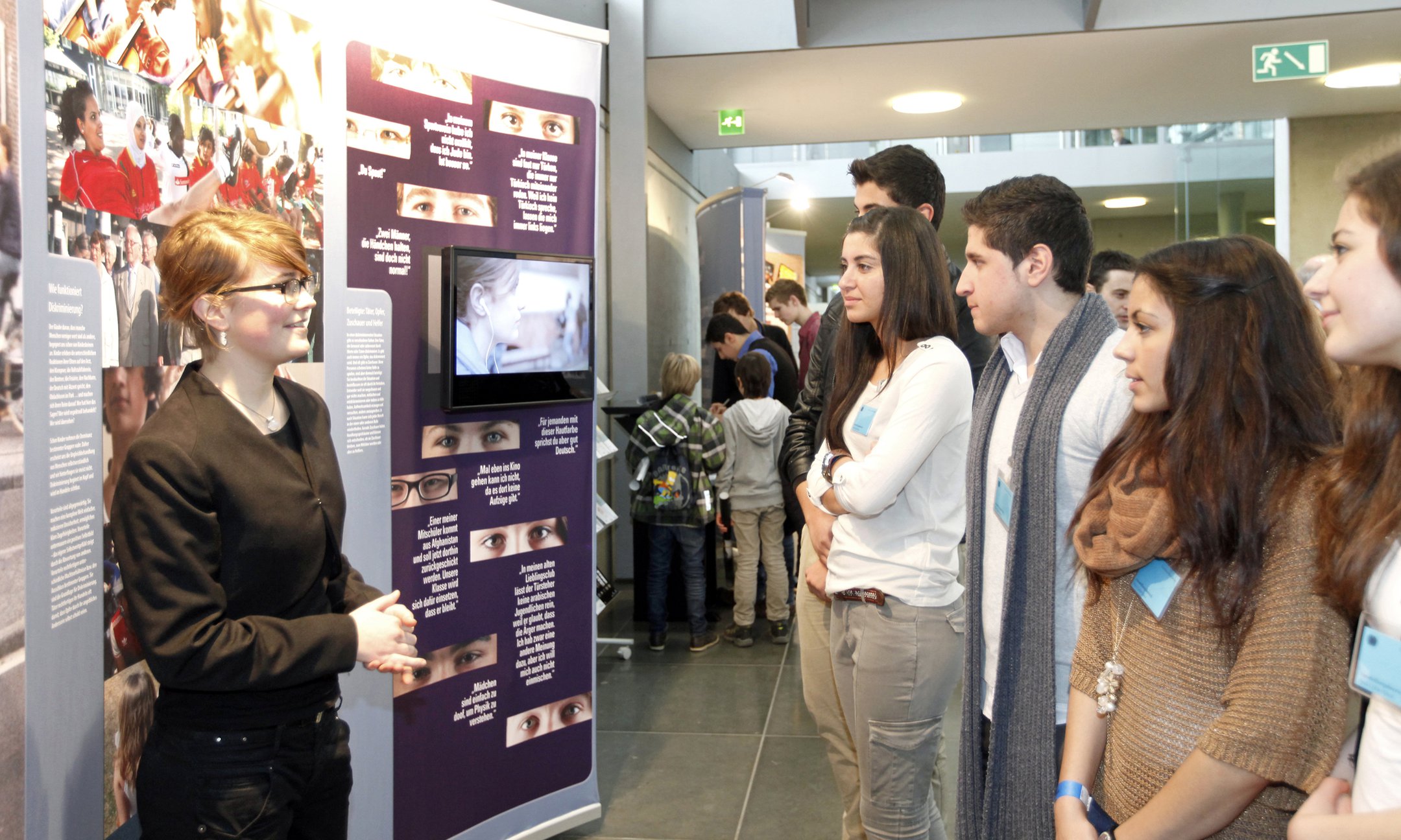 Young people lead other young people through the Anne Frank exhibition